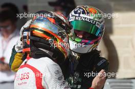 (L to R): Jules Bianchi (FRA) Marussia F1 Team MR02 and Giedo van der Garde (NLD) Caterham CT03 in parc ferme. 17.11.2013. Formula 1 World Championship, Rd 18, United States Grand Prix, Austin, Texas, USA, Race Day.