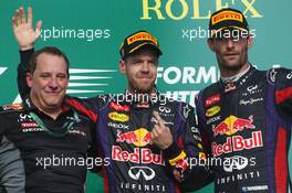 The podium (L to R): Matt Cadieux, Red Bull Racing Chief Information Officer with race winner Sebastian Vettel (GER) Red Bull Racing and second placed Mark Webber (AUS) Red Bull Racing. 17.11.2013. Formula 1 World Championship, Rd 18, United States Grand Prix, Austin, Texas, USA, Race Day.
