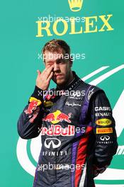 Race winner Sebastian Vettel (GER) Red Bull Racing celebrates on the podium. 17.11.2013. Formula 1 World Championship, Rd 18, United States Grand Prix, Austin, Texas, USA, Race Day.