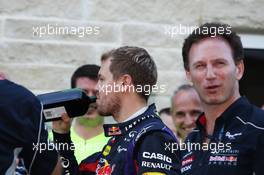 (L to R): Sebastian Vettel (GER) Red Bull Racing with a bottle of Jagermeister and Christian Horner (GBR) Red Bull Racing Team Principal. 17.11.2013. Formula 1 World Championship, Rd 18, United States Grand Prix, Austin, Texas, USA, Race Day.