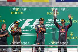 The podium (L to R): Romain Grosjean (FRA) Lotus F1 Team, second; Sebastian Vettel (GER) Red Bull Racing, race winner; Mark Webber (AUS) Red Bull Racing, third. 17.11.2013. Formula 1 World Championship, Rd 18, United States Grand Prix, Austin, Texas, USA, Race Day.