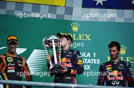 The podium (L to R): Romain Grosjean (FRA) Lotus F1 Team, second; Sebastian Vettel (GER) Red Bull Racing, race winner; Mark Webber (AUS) Red Bull Racing, third. 17.11.2013. Formula 1 World Championship, Rd 18, United States Grand Prix, Austin, Texas, USA, Race Day.