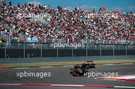 Romain Grosjean (FRA) Lotus F1 E21 leads Mark Webber (AUS) Red Bull Racing RB9. 17.11.2013. Formula 1 World Championship, Rd 18, United States Grand Prix, Austin, Texas, USA, Race Day.