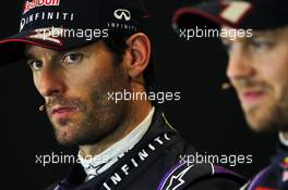 Mark Webber (AUS) Red Bull Racing and team mate Sebastian Vettel (GER) Red Bull Racing in the FIA Press Conference. 16.11.2013. Formula 1 World Championship, Rd 18, United States Grand Prix, Austin, Texas, USA, Qualifying Day.