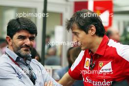 (L to R): Luis Garcia Abad (ESP) Driver Manager of Fernando Alonso (ESP) Ferrari with Massimo Rivola (ITA) Ferrari Sporting Director. 16.11.2013. Formula 1 World Championship, Rd 18, United States Grand Prix, Austin, Texas, USA, Qualifying Day.