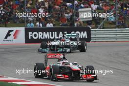 Jenson Button (GBR) McLaren MP4-28 leads Lewis Hamilton (GBR) Mercedes AMG F1 W04. 16.11.2013. Formula 1 World Championship, Rd 18, United States Grand Prix, Austin, Texas, USA, Qualifying Day.