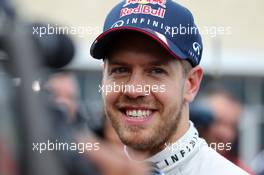 Sebastian Vettel (GER) Red Bull Racing with the media. 16.11.2013. Formula 1 World Championship, Rd 18, United States Grand Prix, Austin, Texas, USA, Qualifying Day.