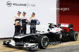 (L to R): Pastor Maldonado (VEN) Williams, team mate Valtteri Bottas (FIN) Williams and Susie Wolff (GBR) Williams Development Driver with the new Williams FW35. 19.02.2013. Williams FW35 Launch, Barcelona, Spain.