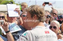 Nico Rosberg (GER) Mercedes AMG F1 signs autographs for the fans. 14.07.2013. Goodwood Festival of Speed, Goodwood, England.