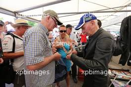 John Surtees (GBR) (Right) signs autographs for the fans. 13.07.2013. Goodwood Festival of Speed, Goodwood, England.