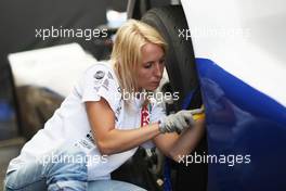 13.07.2013 Nürburgring, Germany, A female mechanic working on the truck of Norbert Kiss (HUN), MAN, Team Oxxo Racing, Round 5