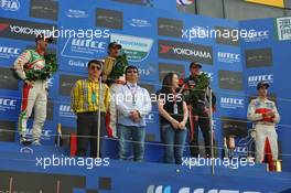 Race1, the podium, winner Yvan Muller (FRA), Chevrolet Cruze 1.6T, RML, 2nd Tiago Monteiro (POR) Honda Civic Super 2000 TC, Honda Racing Team Jas, 3rd Robert Huff (GBR) SEAT Leon WTCC, ALL-INKL.COM Munnich Motorsport and Alex MacDowall (GBR) Chevrolet Cruze 1.6T, bamboo-engineering winner of indipendent 17.11.2013. World Touring Car Championship, Rounds 23 and 24, Macau, China.