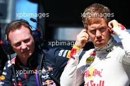 (L to R): Christian Horner (GBR) Red Bull Racing Team Principal and Sebastian Vettel (GER) Red Bull Racing. 14.03.2014. Formula 1 World Championship, Rd 1, Australian Grand Prix, Albert Park, Melbourne, Australia, Practice Day.