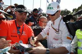 Nico Hulkenberg (GER) Sahara Force India F1 signs autographs for the fans. 14.03.2014. Formula 1 World Championship, Rd 1, Australian Grand Prix, Albert Park, Melbourne, Australia, Practice Day.
