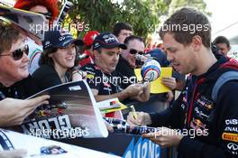 Sebastian Vettel (GER) Red Bull Racing signs autographs for the fans. 14.03.2014. Formula 1 World Championship, Rd 1, Australian Grand Prix, Albert Park, Melbourne, Australia, Practice Day.