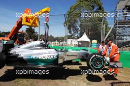 The Mercedes AMG F1 W05 of Lewis Hamilton (GBR) Mercedes AMG F1 is craned from the circuit after he stopped on the out lap of FP1. 14.03.2014. Formula 1 World Championship, Rd 1, Australian Grand Prix, Albert Park, Melbourne, Australia, Practice Day.