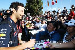 Daniel Ricciardo (AUS) Red Bull Racing signs autographs for the fans. 14.03.2014. Formula 1 World Championship, Rd 1, Australian Grand Prix, Albert Park, Melbourne, Australia, Practice Day.