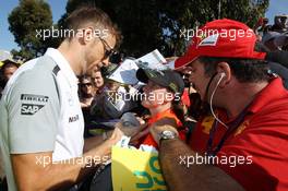 Jenson Button (GBR) McLaren signs autographs for the fans. 14.03.2014. Formula 1 World Championship, Rd 1, Australian Grand Prix, Albert Park, Melbourne, Australia, Practice Day.