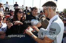 Jenson Button (GBR) McLaren signs autographs for the fans. 14.03.2014. Formula 1 World Championship, Rd 1, Australian Grand Prix, Albert Park, Melbourne, Australia, Practice Day.