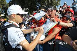 Valtteri Bottas (FIN) Williams signs autographs for the fans. 14.03.2014. Formula 1 World Championship, Rd 1, Australian Grand Prix, Albert Park, Melbourne, Australia, Practice Day.