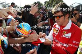 Fernando Alonso (ESP) Ferrari signs autographs for the fans. 14.03.2014. Formula 1 World Championship, Rd 1, Australian Grand Prix, Albert Park, Melbourne, Australia, Practice Day.