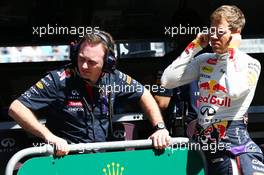 (L to R): Christian Horner (GBR) Red Bull Racing Team Principal with Sebastian Vettel (GER) Red Bull Racing. 14.03.2014. Formula 1 World Championship, Rd 1, Australian Grand Prix, Albert Park, Melbourne, Australia, Practice Day.