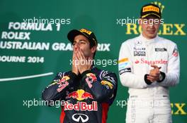 Daniel Ricciardo (AUS) Red Bull Racing RB10 and Kevin Magnussen (DEN) McLaren MP4-29. 16.03.2014. Formula 1 World Championship, Rd 1, Australian Grand Prix, Albert Park, Melbourne, Australia, Race Day.