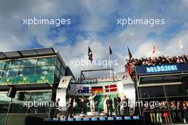 The podium (L to R): Daniel Ricciardo (AUS) Red Bull Racing, second; Nico Rosberg (GER) Mercedes AMG F1, race winner; Kevin Magnussen (DEN) McLaren, third. 16.03.2014. Formula 1 World Championship, Rd 1, Australian Grand Prix, Albert Park, Melbourne, Australia, Race Day.