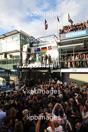 The podium (L to R): Daniel Ricciardo (AUS) Red Bull Racing, second; Nico Rosberg (GER) Mercedes AMG F1, race winner; Kevin Magnussen (DEN) McLaren, third. 16.03.2014. Formula 1 World Championship, Rd 1, Australian Grand Prix, Albert Park, Melbourne, Australia, Race Day.