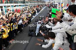 Third placed Kevin Magnussen (DEN) McLaren MP4-29 celebrates with the team as he enters parc ferme. 16.03.2014. Formula 1 World Championship, Rd 1, Australian Grand Prix, Albert Park, Melbourne, Australia, Race Day.