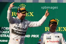 1st place Nico Rosberg (GER) Mercedes AMG F1 W05 and Kevin Magnussen (DEN) McLaren. 16.03.2014. Formula 1 World Championship, Rd 1, Australian Grand Prix, Albert Park, Melbourne, Australia, Race Day.