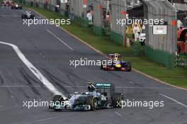 Race winner Lewis Hamilton (GBR) Mercedes AMG F1 W05 leads Daniel Ricciardo (AUS) Red Bull Racing RB10. 16.03.2014. Formula 1 World Championship, Rd 1, Australian Grand Prix, Albert Park, Melbourne, Australia, Race Day.