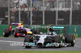 Nico Rosberg (GER) Mercedes AMG F1 W05 leads Daniel Ricciardo (AUS) Red Bull Racing RB10. 16.03.2014. Formula 1 World Championship, Rd 1, Australian Grand Prix, Albert Park, Melbourne, Australia, Race Day.