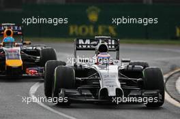 Jenson Button (GBR) McLaren MP4-29 leads Sebastian Vettel (GER) Red Bull Racing RB10. 15.03.2014. Formula 1 World Championship, Rd 1, Australian Grand Prix, Albert Park, Melbourne, Australia, Qualifying Day.