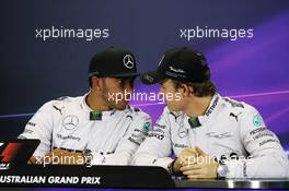 (L to R): Lewis Hamilton (GBR) Mercedes AMG F1 with team mate Nico Rosberg (GER) Mercedes AMG F1 in the FIA Press Conference. 15.03.2014. Formula 1 World Championship, Rd 1, Australian Grand Prix, Albert Park, Melbourne, Australia, Qualifying Day.