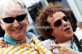 (L to R): John Watson (GBR) with Leo Sayer (AUS). 15.03.2014. Formula 1 World Championship, Rd 1, Australian Grand Prix, Albert Park, Melbourne, Australia, Qualifying Day.