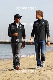 (L to R): Lewis Hamilton (GBR) Mercedes AMG F1 and team mate Nico Rosberg (GER) Mercedes AMG F1 W05 on the beach. 13.03.2014. Formula 1 World Championship, Rd 1, Australian Grand Prix, Albert Park, Melbourne, Australia, Preparation Day.