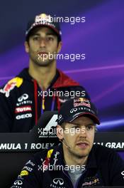 Sebastian Vettel (GER) Red Bull Racing and team mate Daniel Ricciardo (AUS) Red Bull Racing in the FIA Press Conference. 13.03.2014. Formula 1 World Championship, Rd 1, Australian Grand Prix, Albert Park, Melbourne, Australia, Preparation Day.