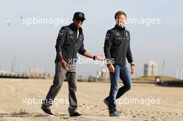(L to R): Lewis Hamilton (GBR) Mercedes AMG F1 and team mate Nico Rosberg (GER) Mercedes AMG F1 W05 on the beach. 13.03.2014. Formula 1 World Championship, Rd 1, Australian Grand Prix, Albert Park, Melbourne, Australia, Preparation Day.
