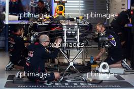 The Red Bull Racing RB10 of Sebastian Vettel (GER) Red Bull Racing is prepared by mechanics in the pits. 13.03.2014. Formula 1 World Championship, Rd 1, Australian Grand Prix, Albert Park, Melbourne, Australia, Preparation Day.