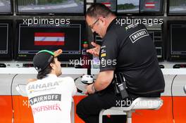 Sergio Perez (MEX) Sahara Force India F1 VJM07 with Tom McCullough (GBR) Sahara Force India F1 Team Chief Engineer. 20.06.2014. Formula 1 World Championship, Rd 8, Austrian Grand Prix, Spielberg, Austria, Practice Day.