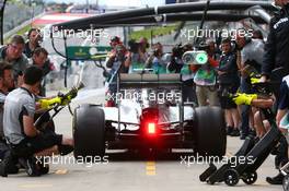 Lewis Hamilton (GBR) Mercedes AMG F1 W05 practices a pit stop. 20.06.2014. Formula 1 World Championship, Rd 8, Austrian Grand Prix, Spielberg, Austria, Practice Day.
