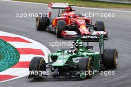 Kamui Kobayashi (JPN) Caterham CT05 leads Kimi Raikkonen (FIN) Ferrari F14-T. 20.06.2014. Formula 1 World Championship, Rd 8, Austrian Grand Prix, Spielberg, Austria, Practice Day.