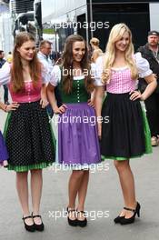 Girls in local dress. 20.06.2014. Formula 1 World Championship, Rd 8, Austrian Grand Prix, Spielberg, Austria, Practice Day.