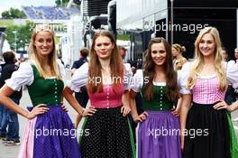 Girls in local dress. 20.06.2014. Formula 1 World Championship, Rd 8, Austrian Grand Prix, Spielberg, Austria, Practice Day.
