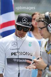 Lewis Hamilton (GBR) Mercedes AMG F1 on the grid with Peter Bonnington (GBR) Mercedes AMG F1 Race Engineer. 22.06.2014. Formula 1 World Championship, Rd 8, Austrian Grand Prix, Spielberg, Austria, Race Day.