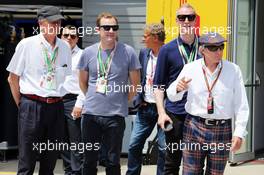 Jackie Stewart (GBR) with Sir James Dyson (GBR) Inventor and his family. 22.06.2014. Formula 1 World Championship, Rd 8, Austrian Grand Prix, Spielberg, Austria, Race Day.