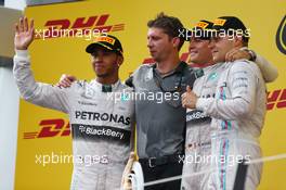 1st place Nico Rosberg (GER) Mercedes AMG F1 with 2nd place Lewis Hamilton (GBR) Mercedes AMG F1 W05 and 3rd place Valtteri Bottas (FIN) Williams FW36. 22.06.2014. Formula 1 World Championship, Rd 8, Austrian Grand Prix, Spielberg, Austria, Race Day.