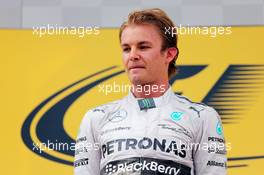 Race winner Nico Rosberg (GER) Mercedes AMG F1 on the podium. 22.06.2014. Formula 1 World Championship, Rd 8, Austrian Grand Prix, Spielberg, Austria, Race Day.