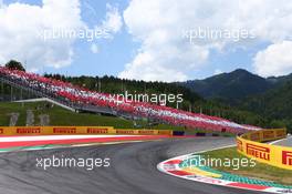 Fans at turn 1. 22.06.2014. Formula 1 World Championship, Rd 8, Austrian Grand Prix, Spielberg, Austria, Race Day.